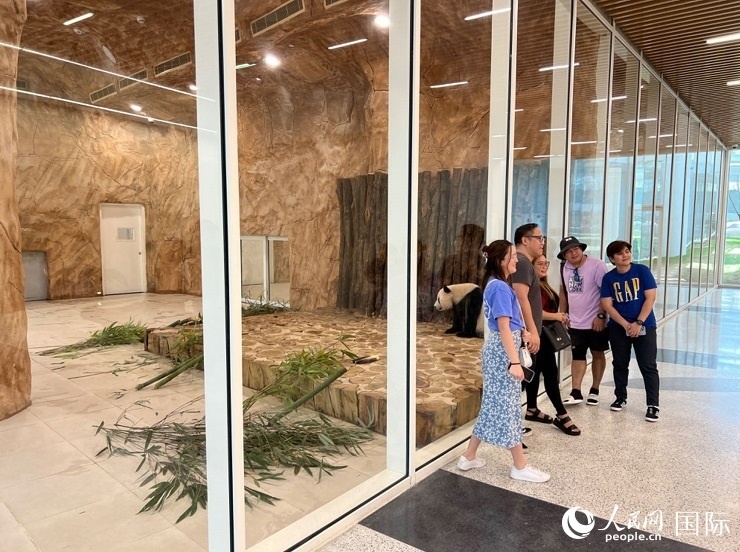 當(dāng)?shù)赜慰团c“四?！焙嫌?。人民網(wǎng)記者 張志文攝